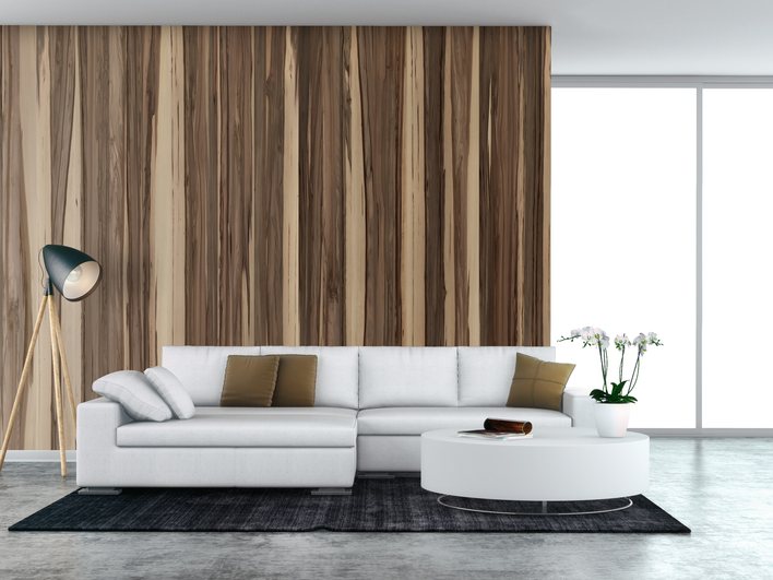 Montreal living room with a wood feature wall and a pale sectional sofa